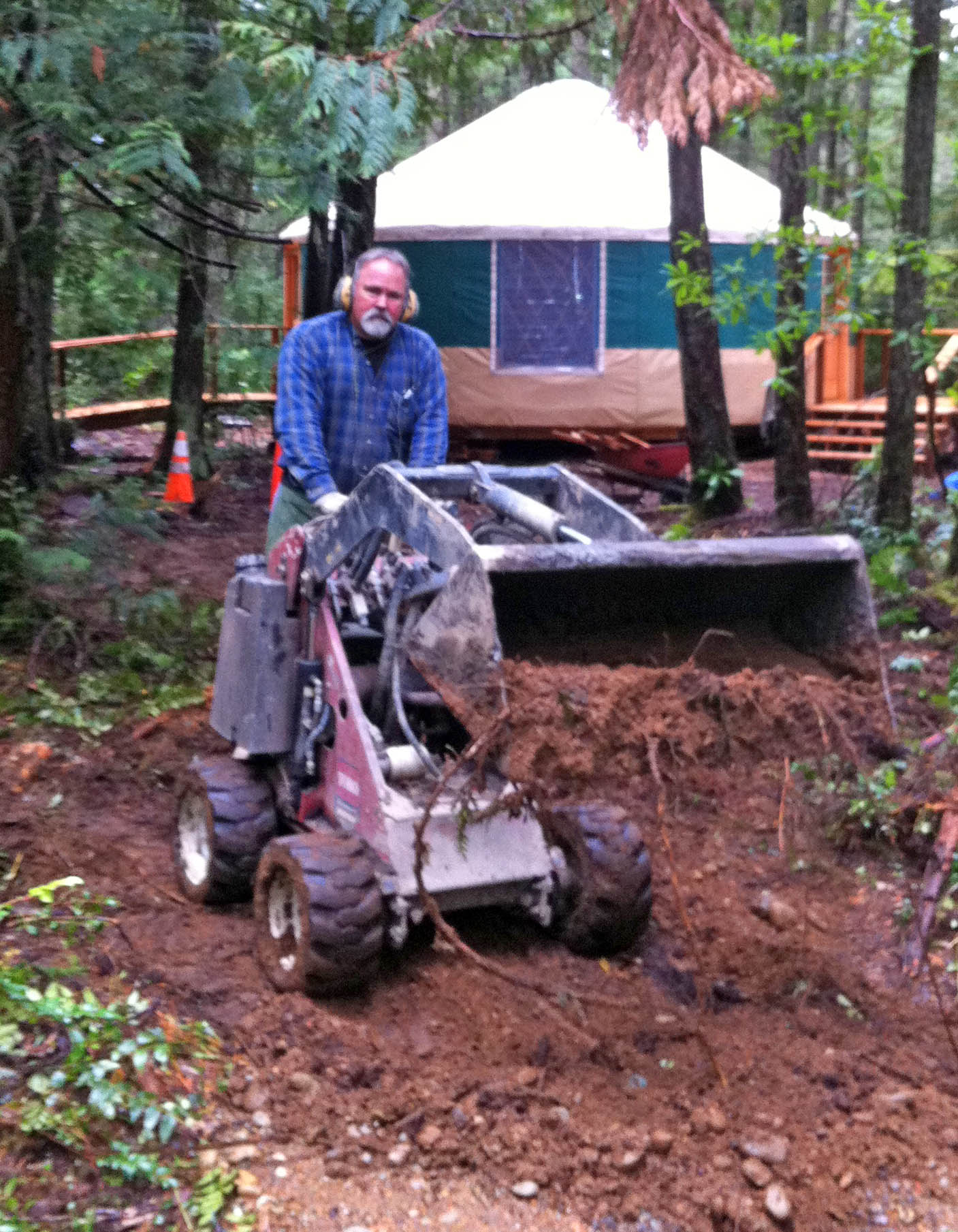 Craig McCoy filling in electrical ditch
